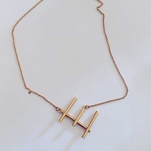 Monogrammed E sideways necklace